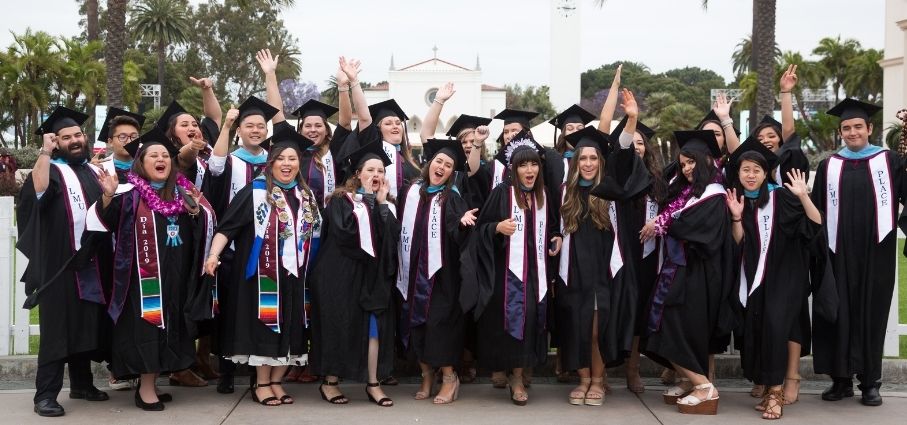 graduates at SO celebrating at commencement on LMU's campus